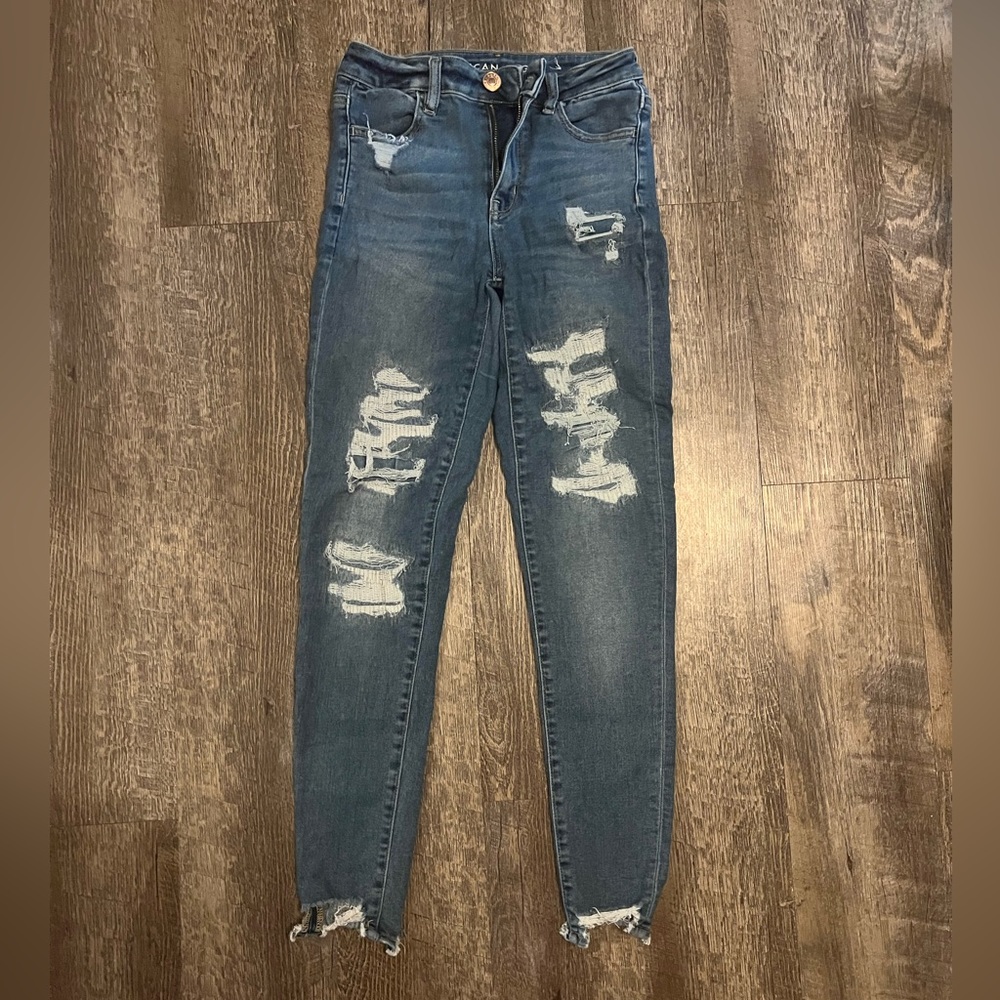 American eagle jeans. Very stretchy. Size 4. Holes are patched.